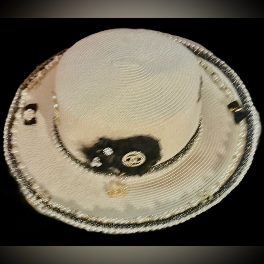 Chanel hat, elegant tasteful, and goes with any outfit.